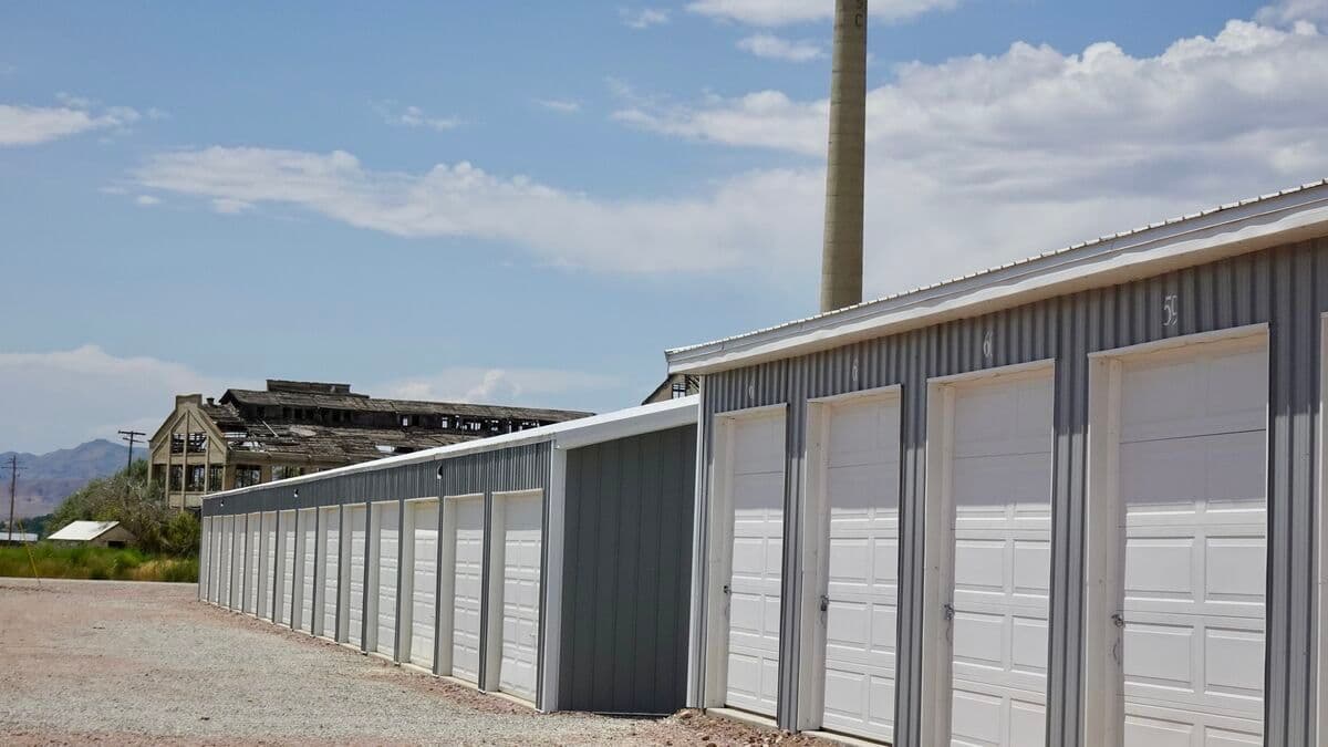 Wide view of the storage complex with historic sugar factory in the background