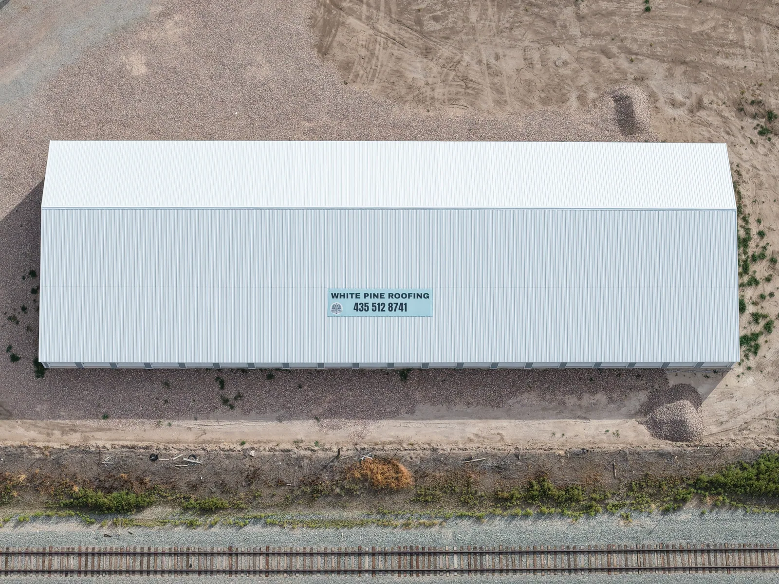 Aerial view of a newly roofed storage building at Sugar Factory Storage Complex in Preston, Idaho